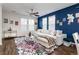 Comfortable living room boasts hardwood floors, a plush white sofa, and bright natural light at 3412 Valentia St, Denver, CO 80238