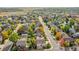 Aerial view of a home in a neighborhood with mature trees at 106 Cherry St, Castle Rock, CO 80104