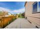Fenced backyard with a concrete patio and well-maintained siding at 106 Cherry St, Castle Rock, CO 80104