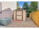 Backyard view showcasing shed, AC unit, and privacy fence at 106 Cherry St, Castle Rock, CO 80104