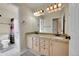 Bright bathroom with double vanity, granite countertop, and neutral-toned cabinetry at 106 Cherry St, Castle Rock, CO 80104