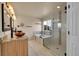Modern bathroom with double sink vanity, soaking tub, and a glass-enclosed shower at 106 Cherry St, Castle Rock, CO 80104
