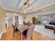 Dining room with pendant lighting, a marble-top table, hardwood floors, and a comfortable couch at 106 Cherry St, Castle Rock, CO 80104