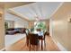 Dining room with a table set for six, hardwood floors, and natural light from a window at 106 Cherry St, Castle Rock, CO 80104
