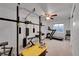 Basement gym featuring weightlifting equipment, treadmill, and ceiling fan at 106 Cherry St, Castle Rock, CO 80104