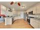 Bright kitchen featuring stainless steel appliances, granite counters, and hardwood floors at 106 Cherry St, Castle Rock, CO 80104