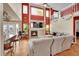 Bright, open living room with a fireplace, tall windows, and barstool seating at 106 Cherry St, Castle Rock, CO 80104