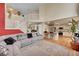 Large living room with an open staircase, a bar counter, and an open kitchen at 106 Cherry St, Castle Rock, CO 80104
