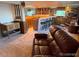 Spacious basement with a bar, ample seating, and a cozy entertainment area at 6958 Brentwood Ct, Arvada, CO 80004