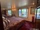 Main bedroom featuring a large window and bay window to allow natural light at 6958 Brentwood Ct, Arvada, CO 80004