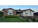 Charming single-Gathering home with brick and siding exterior and well-manicured lawn at 6958 Brentwood Ct, Arvada, CO 80004