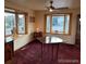 Cozy living room featuring bay windows, carpet flooring, and natural light at 6958 Brentwood Ct, Arvada, CO 80004