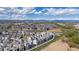 A thriving community of modern townhomes, open spaces, and mountain views at 12374 Farmview St, Thornton, CO 80241