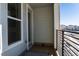 Private balcony with a view of the neighborhood and a door leading inside at 12374 Farmview St, Thornton, CO 80241