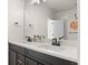 Stylish bathroom with double sinks set in a well-lit vanity area with modern fixtures and decor at 12374 Farmview St, Thornton, CO 80241