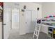 Playful bedroom with a bunk bed, sliding closet doors, and a cheerful decor for a space at 12374 Farmview St, Thornton, CO 80241