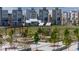 A community park with playground, picnic tables nestled amongst contemporary townhomes at 12374 Farmview St, Thornton, CO 80241