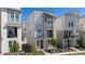 Attractive three-story townhome showcasing a modern exterior and well-manicured landscaping at 12374 Farmview St, Thornton, CO 80241
