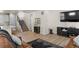 Open living room area featuring modern decor and staircase access to the upper level at 12374 Farmview St, Thornton, CO 80241