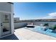 Rooftop deck with outdoor seating, fire pit, and views of the neighborhood under a clear blue sky at 12374 Farmview St, Thornton, CO 80241
