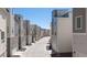 Clean street view highlighting modern townhomes and rear entry garages at 12374 Farmview St, Thornton, CO 80241