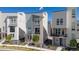 Stylish two-story townhome featuring modern design, ample windows, and a cozy front porch at 12374 Farmview St, Thornton, CO 80241