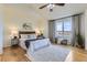 Serene main bedroom features hardwood floors, a large window with views, and neutral decor for a relaxing retreat at 4735 Bobolink Dr, Castle Rock, CO 80109