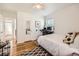 Cozy bedroom with hardwood floors and neutral decor at 2361 Olive St, Denver, CO 80207