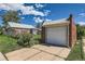 Detached one car garage with a driveway at 2361 Olive St, Denver, CO 80207