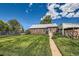 Charming brick home with a well-manicured lawn and inviting curb appeal at 2361 Olive St, Denver, CO 80207