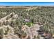 Stunning aerial view of an estate surrounded by vast forested land and open fields at 38666 County Road 21, Elizabeth, CO 80107