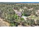 Expansive aerial view of a secluded home nestled among towering trees and greenery at 38666 County Road 21, Elizabeth, CO 80107