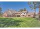 Expansive backyard features a lush, meticulously maintained lawn perfect for outdoor activities at 38666 County Road 21, Elizabeth, CO 80107