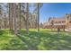 Picturesque backyard with mature trees creating a serene, park-like setting at 38666 County Road 21, Elizabeth, CO 80107