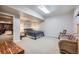 Comfortable basement bedroom with a queen bed and cozy seating area at 38666 County Road 21, Elizabeth, CO 80107