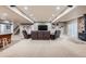Open basement living area with a home theater system and comfortable seating at 38666 County Road 21, Elizabeth, CO 80107