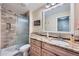 Bathroom featuring a granite vanity and a tiled shower with glass door at 38666 County Road 21, Elizabeth, CO 80107