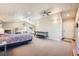 Spacious bedroom with multiple beds, carpeted floors, and a vaulted ceiling, perfect for a large Gathering or group at 38666 County Road 21, Elizabeth, CO 80107
