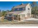 Charming two-story home with a two-car garage and well-maintained lawn at 38666 County Road 21, Elizabeth, CO 80107