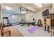 Basement home gym equipped with various exercise machines and weights, perfect for fitness enthusiasts at 38666 County Road 21, Elizabeth, CO 80107