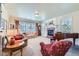 Cozy living room features a fireplace, large windows, and comfortable seating, perfect for relaxation at 38666 County Road 21, Elizabeth, CO 80107