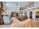 Spacious living room with a soaring ceiling, a fireplace, elegant furnishings, and ample natural light at 38666 County Road 21, Elizabeth, CO 80107
