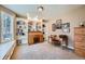 Bright home office with custom built-in shelving, a large window, and classic wood furniture at 38666 County Road 21, Elizabeth, CO 80107