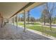 Covered patio with stone flooring that provides an inviting outdoor living space at 38666 County Road 21, Elizabeth, CO 80107