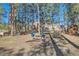 Outdoor playground area featuring swings and climbing structure with mature trees in the background at 38666 County Road 21, Elizabeth, CO 80107
