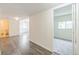 The long hallway features wood-style floors, neutral walls, and leads into a carpeted room at 462 Chelan St, Golden, CO 80401