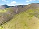 Sweeping aerial view of rolling hills, rugged hiking, and scenic trails at 6634 Window Rock Ln, Morrison, CO 80465