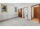 Bright bedroom with carpet flooring, natural light, and en-suite bathroom access at 6634 Window Rock Ln, Morrison, CO 80465