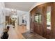 Inviting entryway with hardwood floors, staircase, and a view of the living spaces at 6634 Window Rock Ln, Morrison, CO 80465