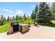 Outdoor cooking area with grill, fire pit, seating, and expansive, picturesque scenery at 6634 Window Rock Ln, Morrison, CO 80465